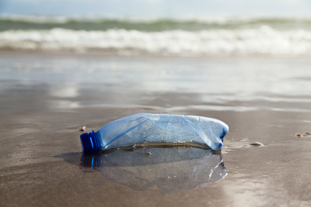A plastic bottle left on the shoreline