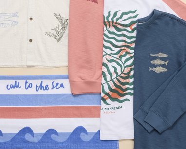 Clothes from the Fatface X Marine Conservation Society 2026 collection laid flat. The towel reads 'call to the sea'.