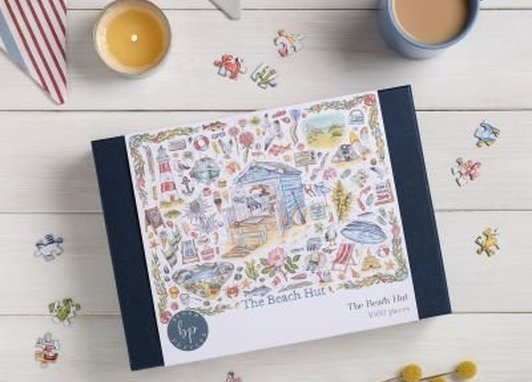 "The Beach Hut" 1000-piece jigsaw puzzle by Bloom Puzzles, featuring illustration artwork by Amy Holliday.