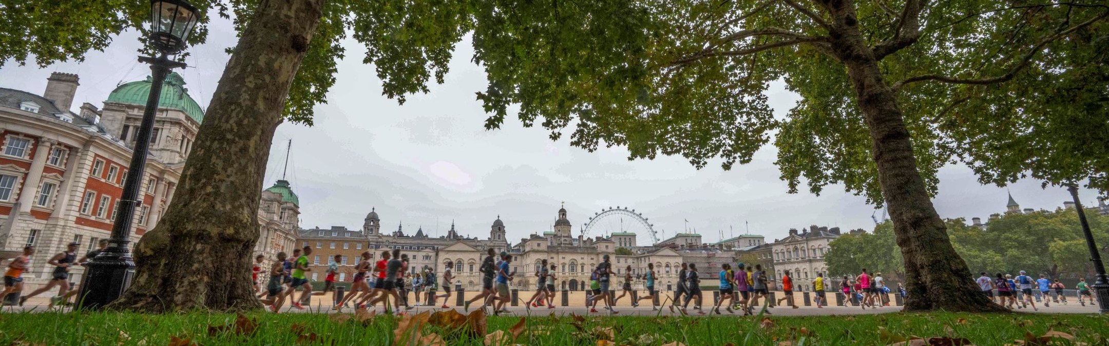Runners are pictured running through a London Park as part of the Royal Parks half marathon. The London Eye can be seen in the background.