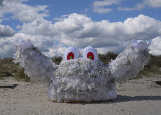 a large art installation named "Wallace," a monster created from wet wipes to highlight environmental pollution.