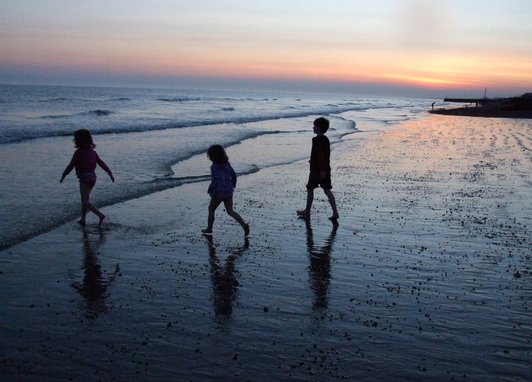 Silhouette of children on a beach