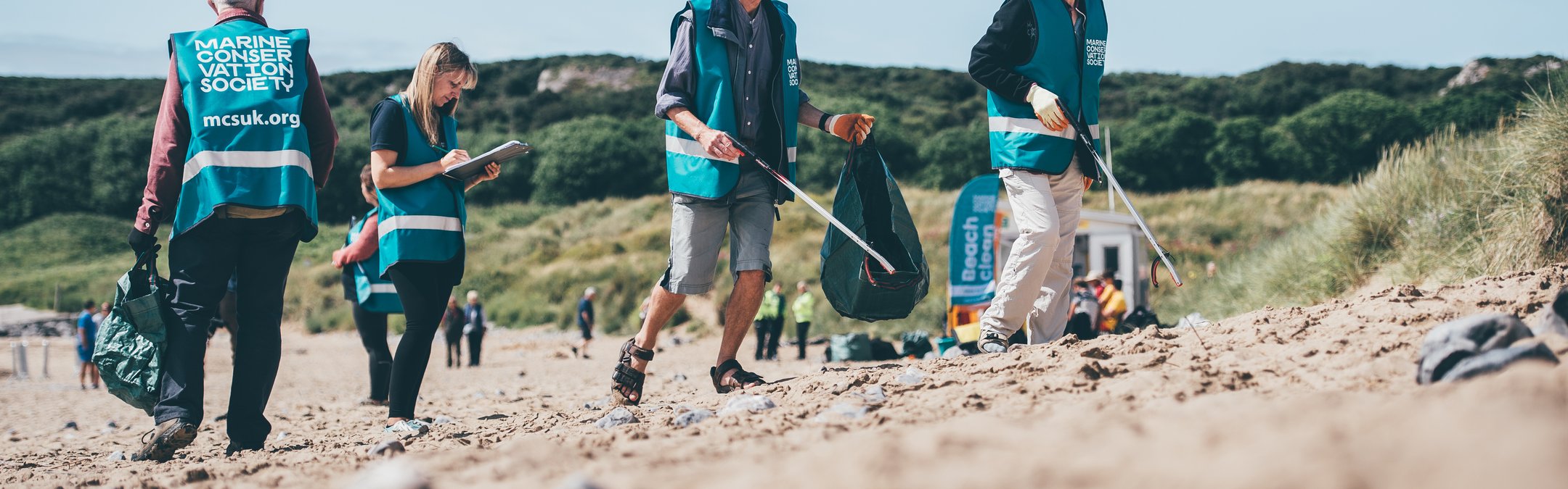 Group of people beach cleaning