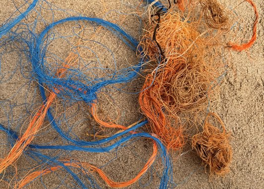 Some Blue and orange rope tangled up together