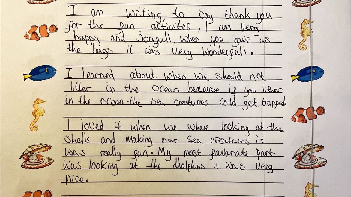 A child's letter written to the lead of the One Ocean Roadshow thanking them for the fun activities. Sea animals line the paper on both sides.